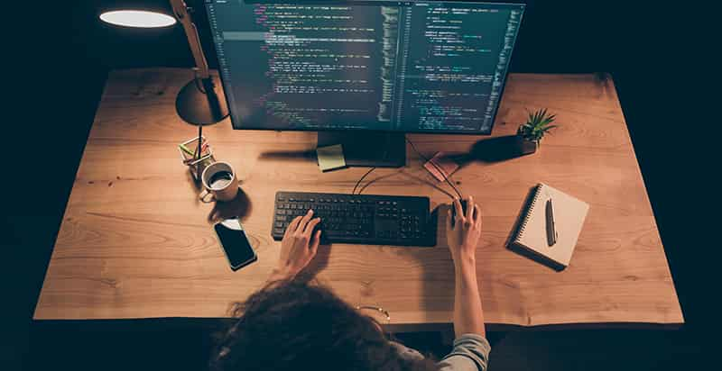 A overhead view of a person working on a computer